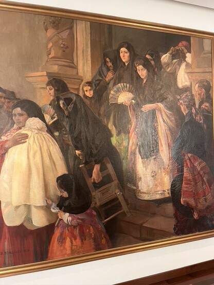 Title: Leaving Mass in Rocafort
Painter: José Benlliure Ortiz
1915

Devotees leaving a church, with gestures of religious fervor and more subdued colors, creating a serene and devotional atmosphere.