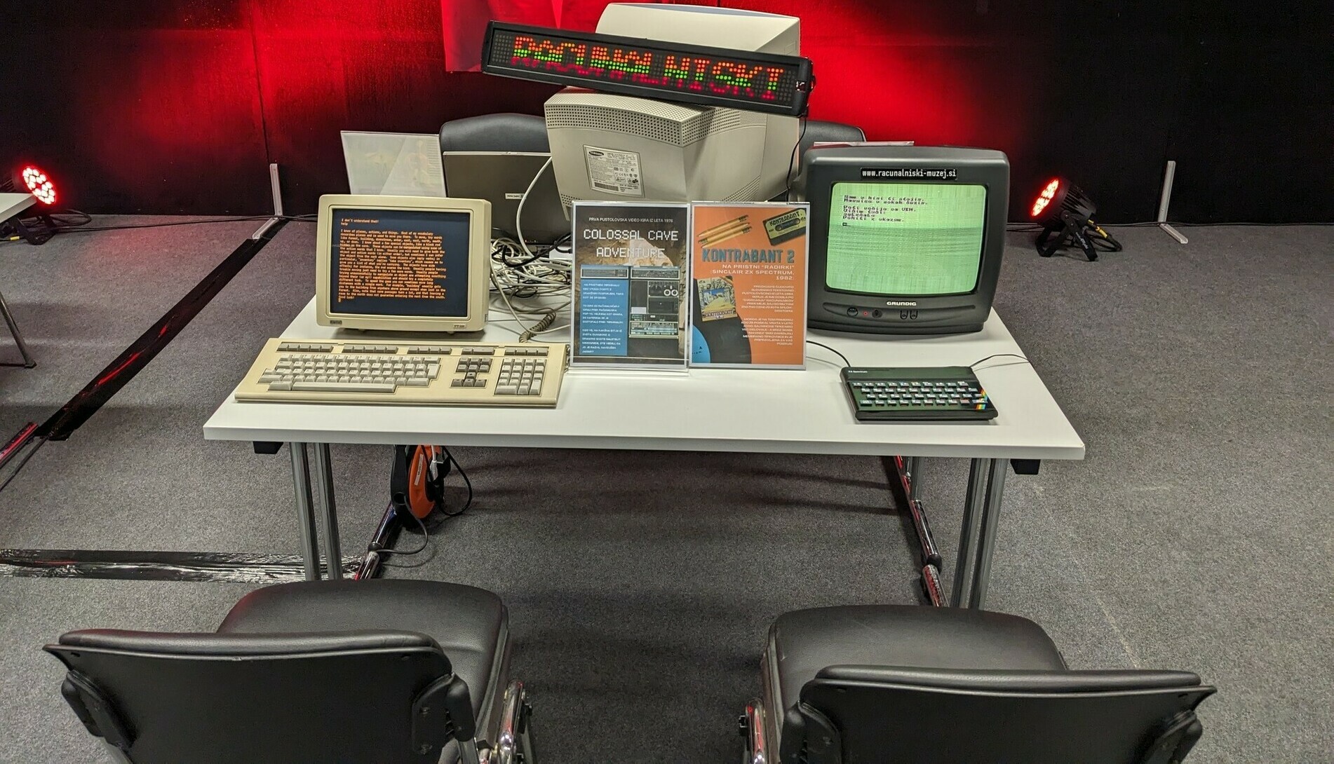 Two retro computers on a table.